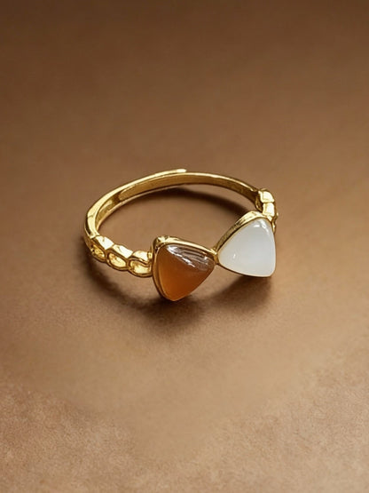 Close-up of two-tone jade ring showing white and green colors