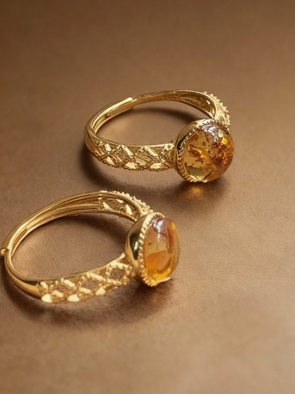 Flower amber ring with golden honey-colored stone