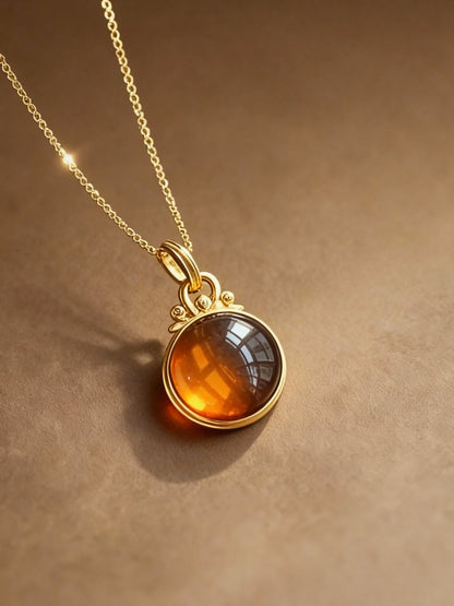 Close-up of blood amber pendant showing rich burgundy color