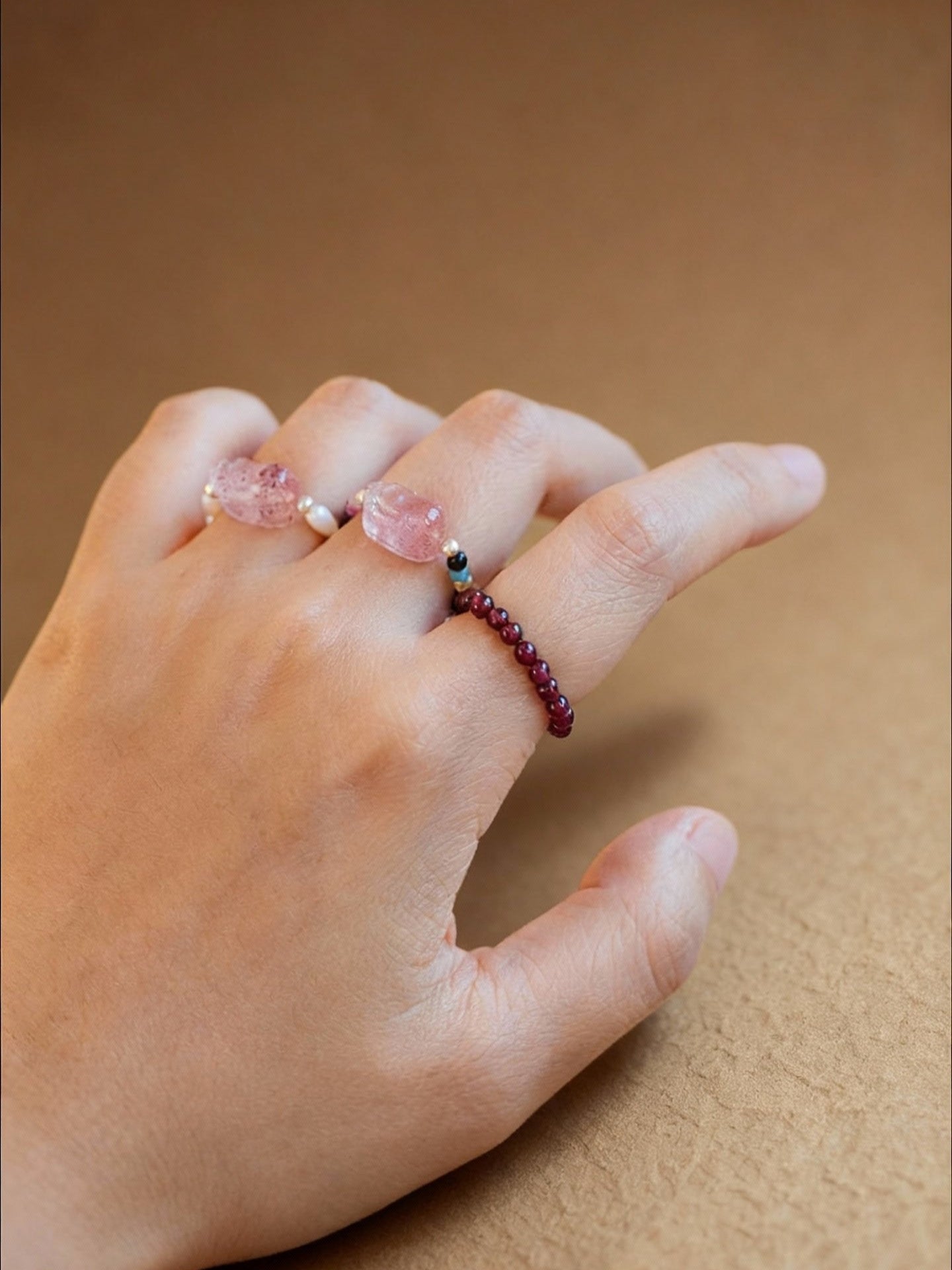 Tourmaline and strawberry quartz ring featuring Pixiu wealth charm