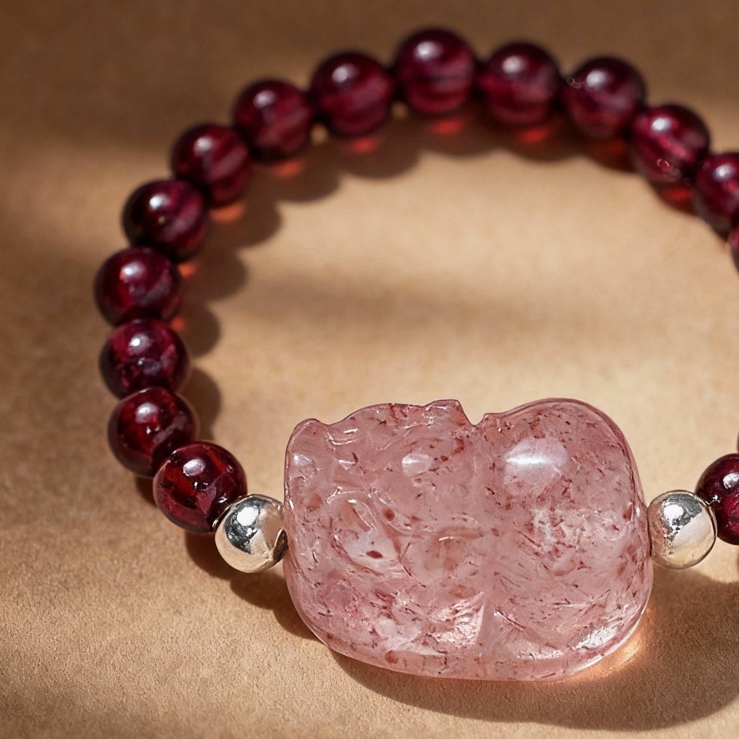 Detail of natural tourmaline and garnet ring with Pixiu design