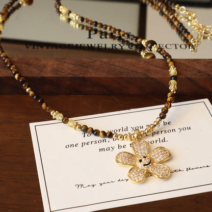Natural tiger eye beaded necklace with sparkling flower pendant