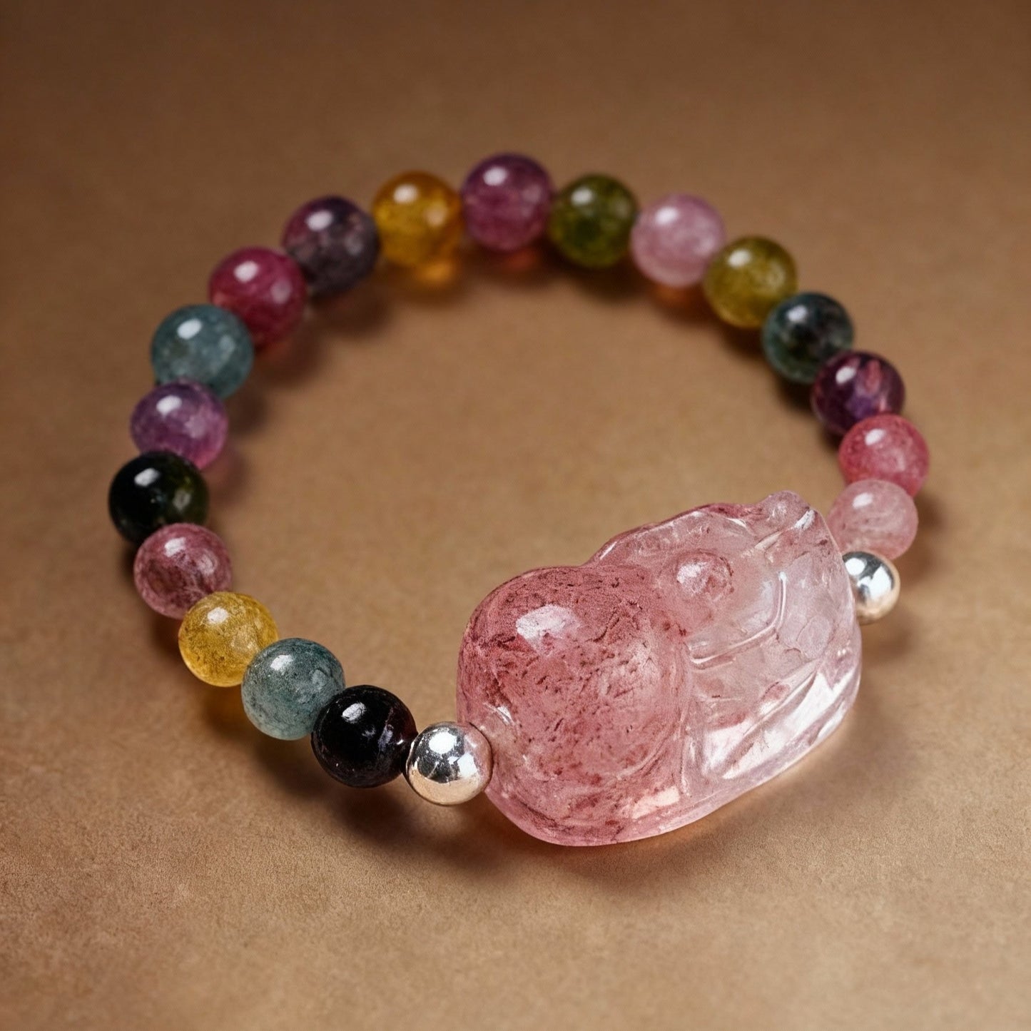 Detail of natural tourmaline and strawberry quartz ring with Pixiu design