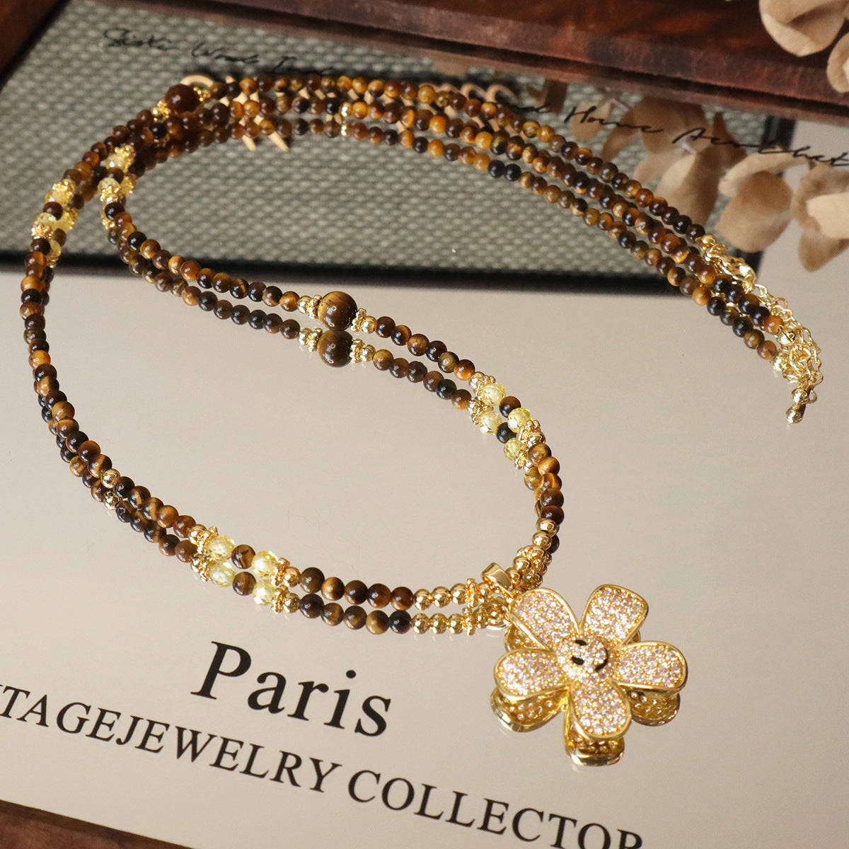 Tiger eye long sweater chain with zircon flower charm detail