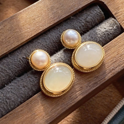 Detail of nephrite jade earrings with freshwater pearl accents
