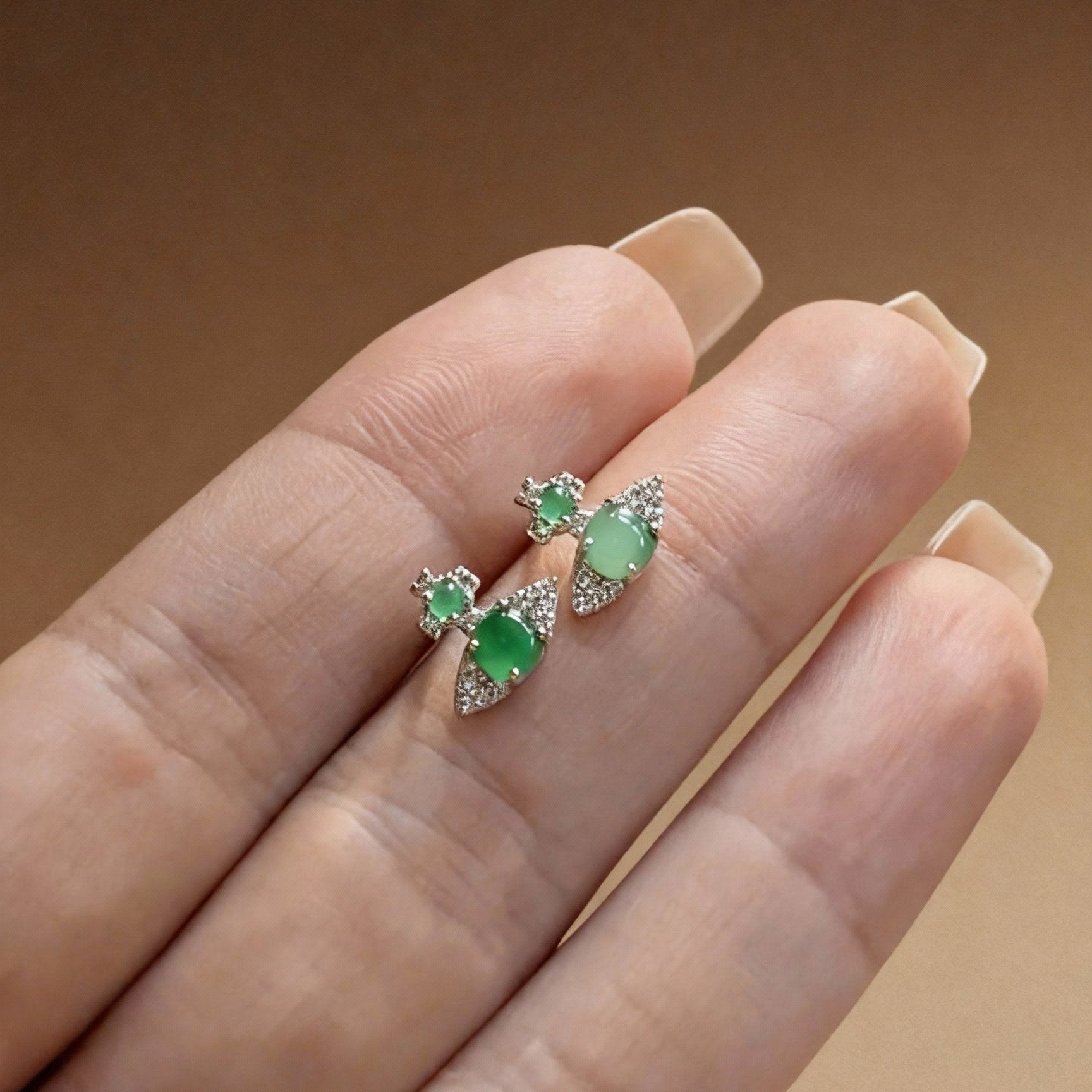 Detail of natural jade jasper earrings with lush green tones