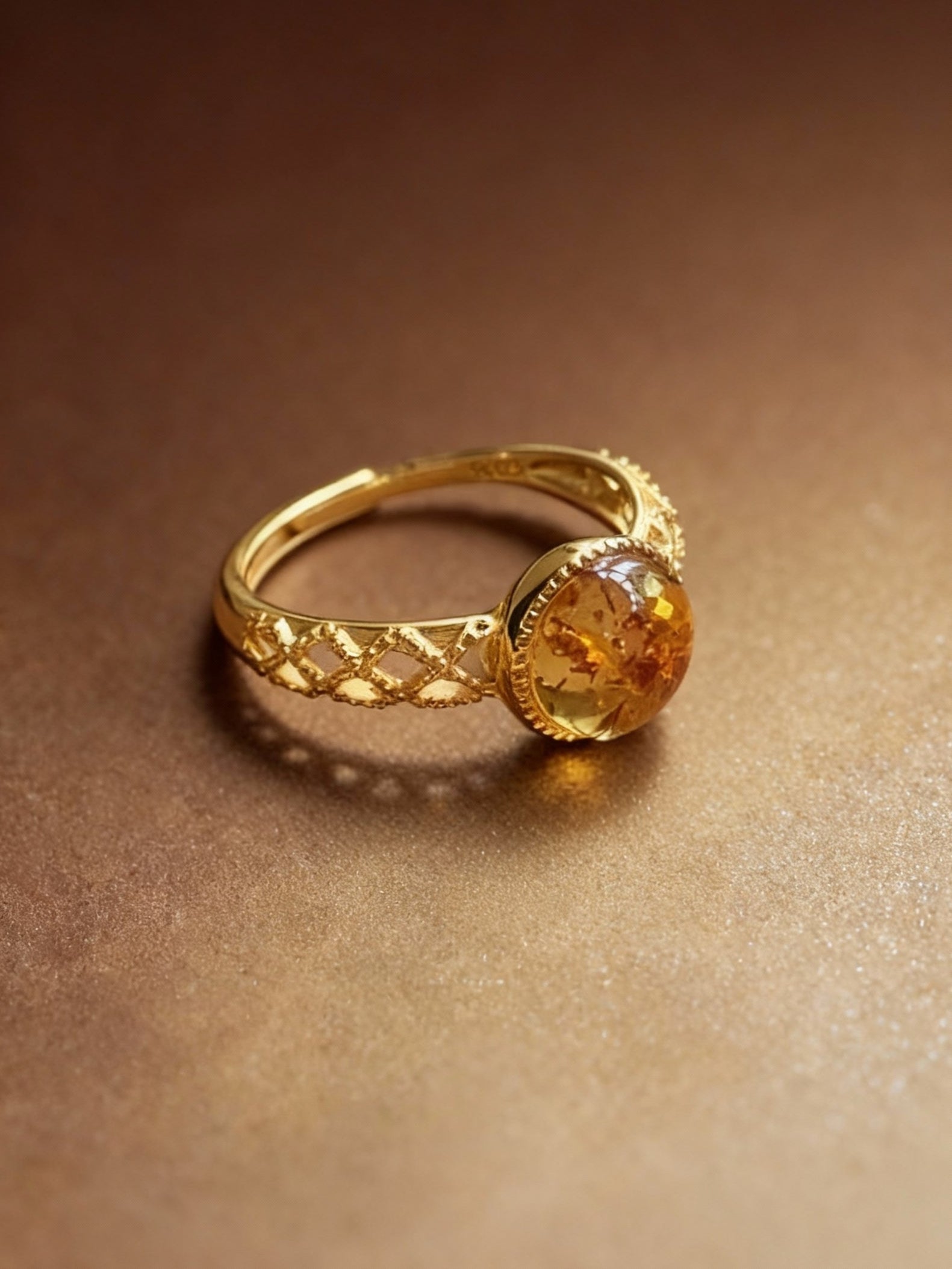 Natural amber ring showing translucent honey-glow finish