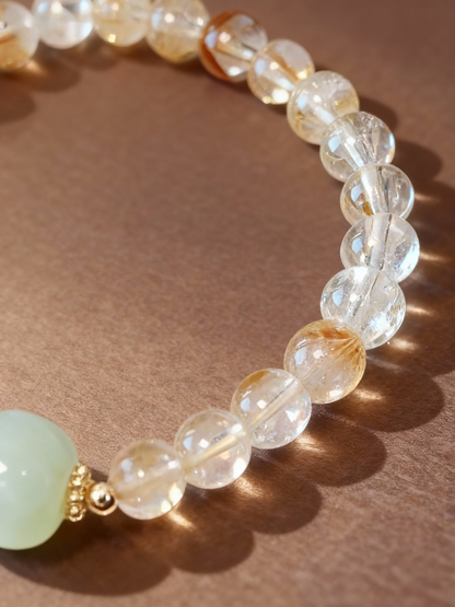 Citrine and nephrite jade fortune bracelet showing golden beads