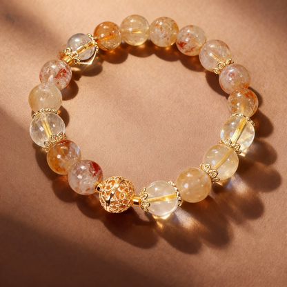 Close-up of golden rutilated quartz beads with metal accent bead