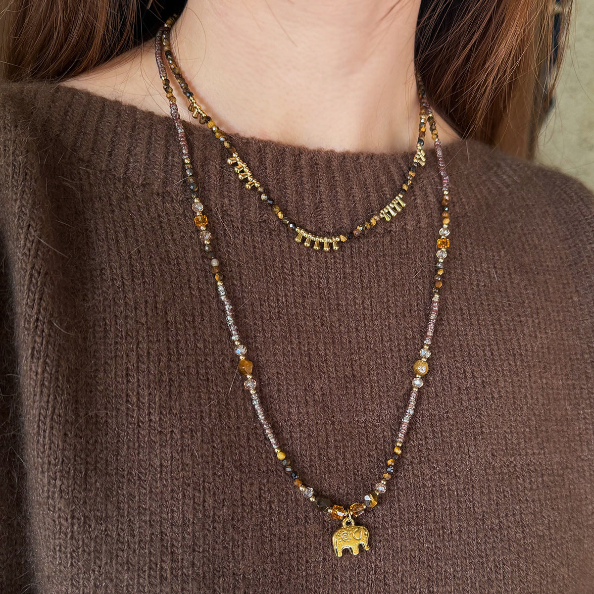 Long tiger eye necklace with elephant pendant detail