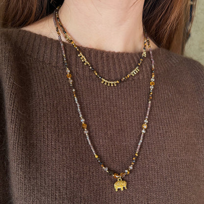 Long tiger eye necklace with elephant pendant detail