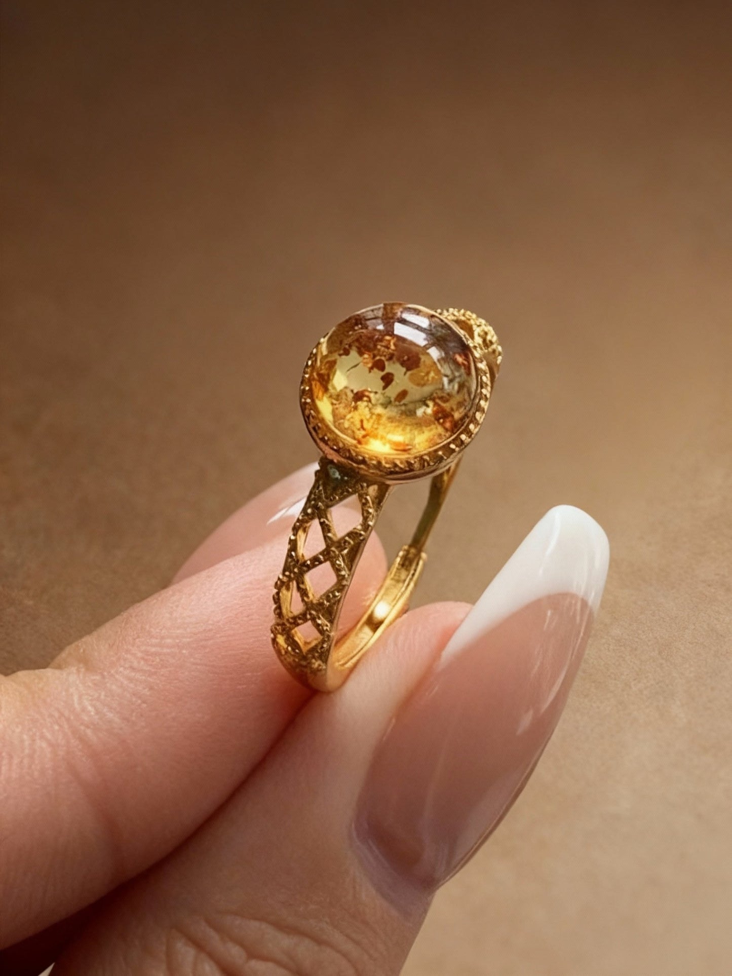 Close-up of natural amber ring showing honey-colored glow