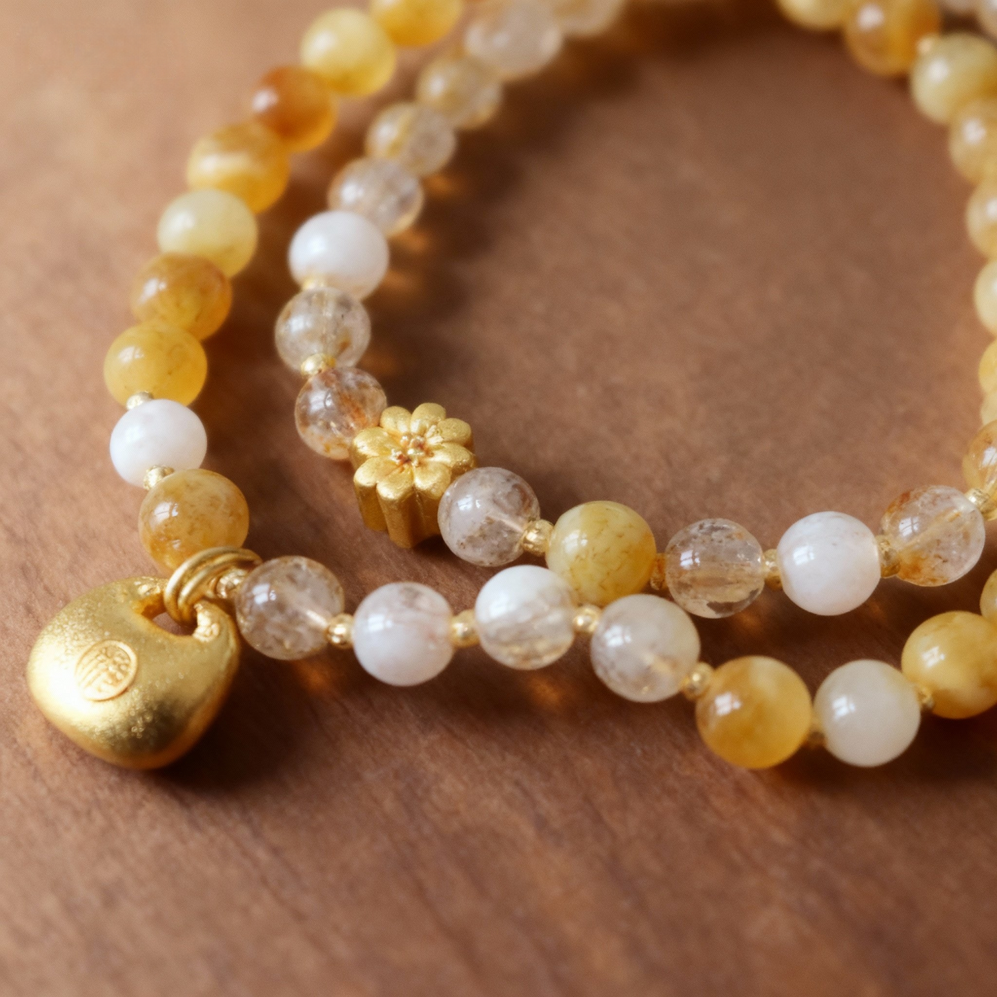 Close-up of golden rutilated quartz double-strand beaded bracelet
