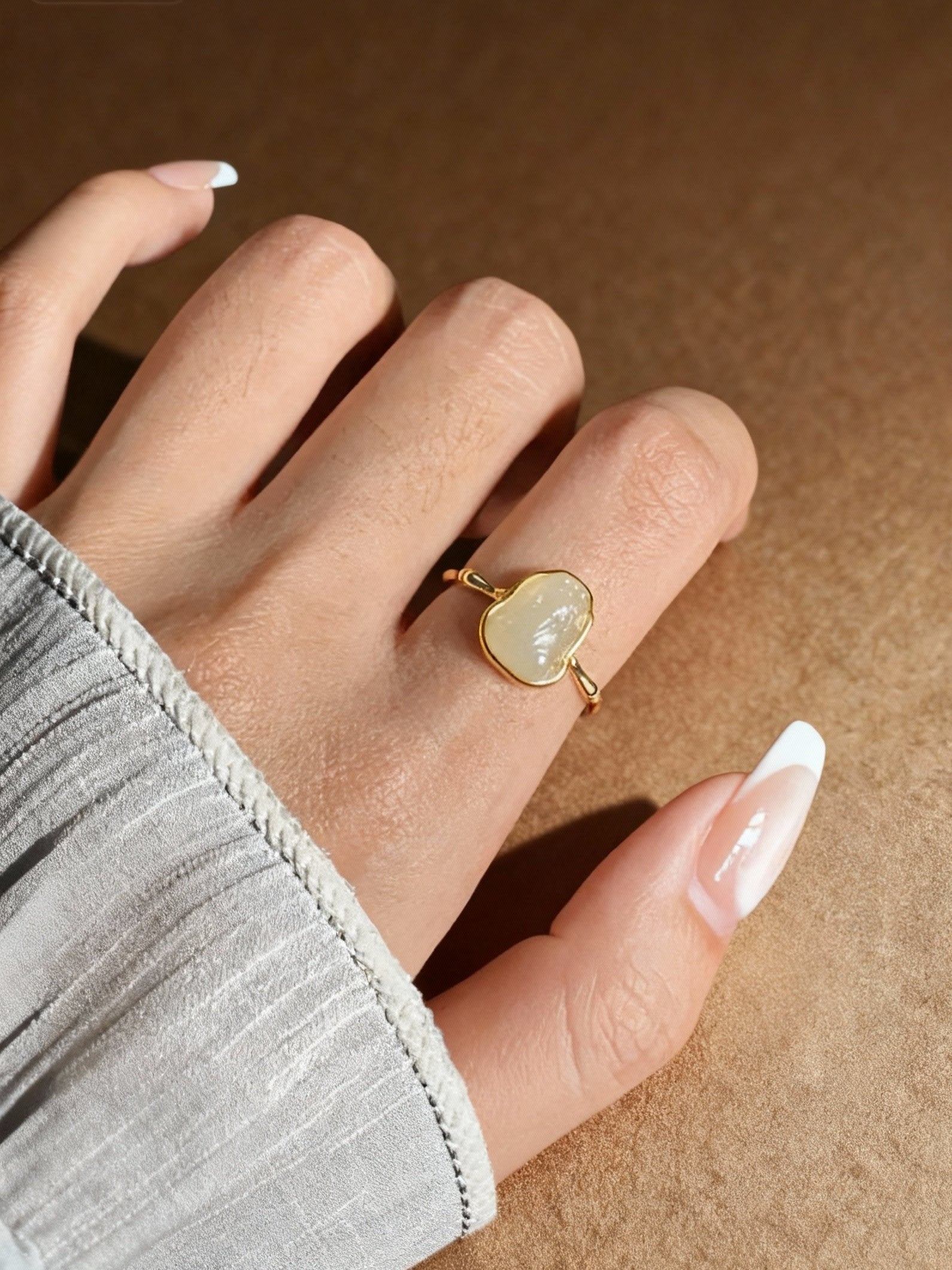 Hetian white jade ring showing smooth carved band