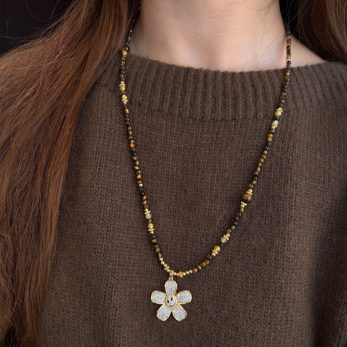 Natural tiger eye sweater chain showing chatoyant bead effect