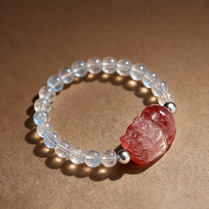 Close-up of tourmaline ring with Pixiu charm and clear quartz