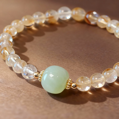 Detail of yellow citrine bracelet with nephrite jade Buddha