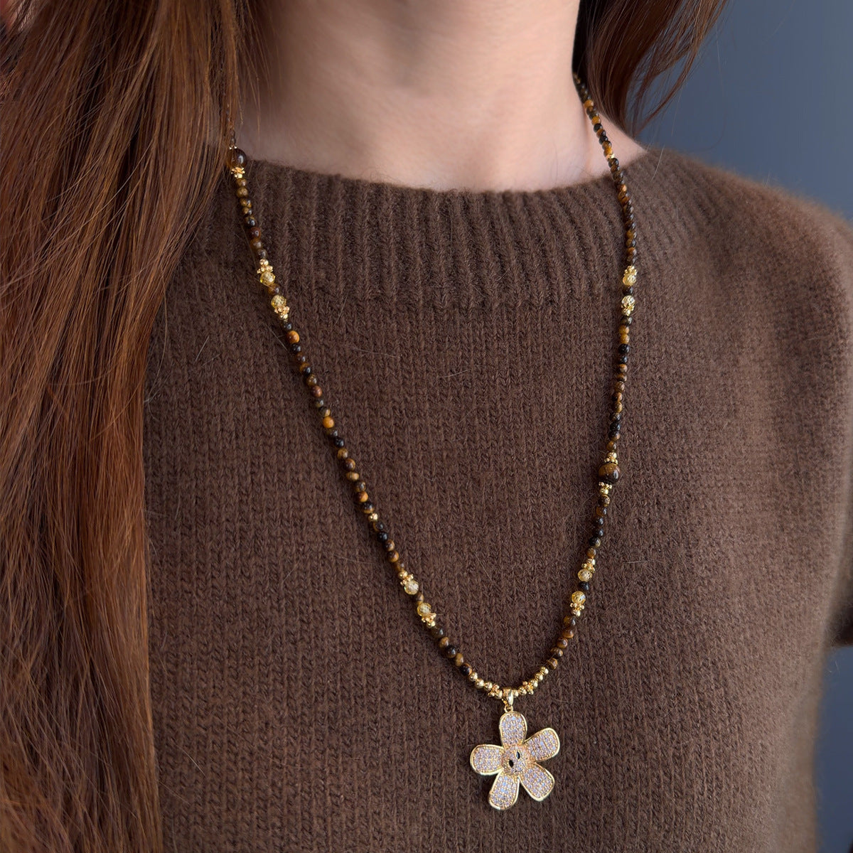 Long tiger eye necklace with decorative zircon flower detail