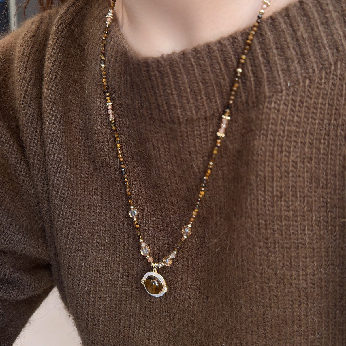 Long tiger eye necklace with decorative mother-of-pearl charm