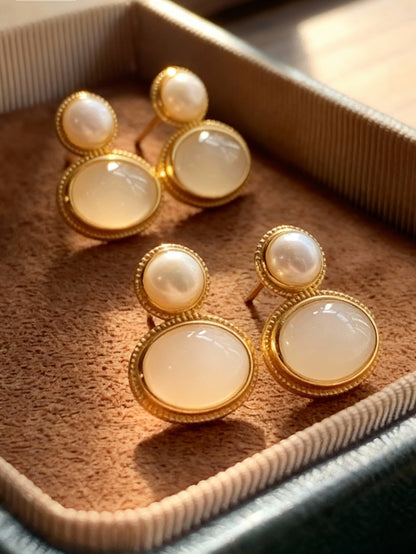 Nephrite jade earrings featuring white pearl and green stone