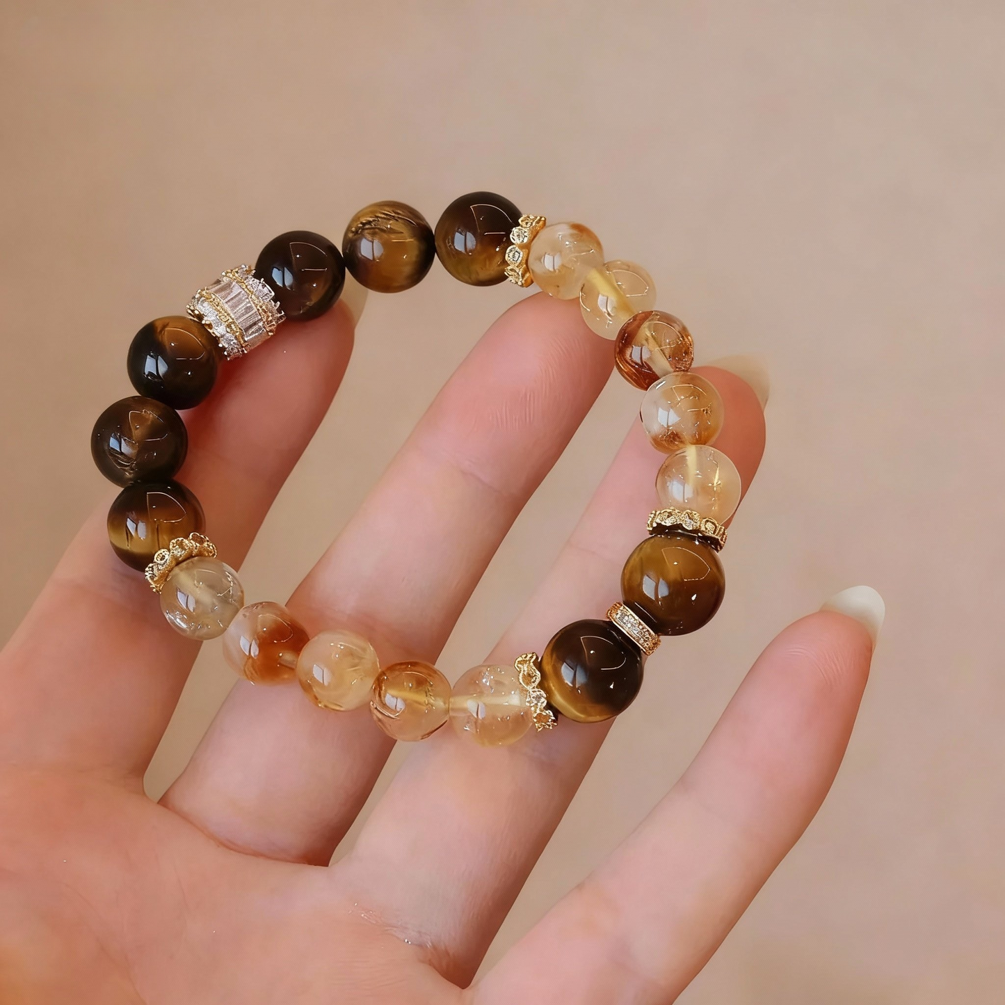 Detail of golden rutilated quartz and tiger's eye beaded bracelet