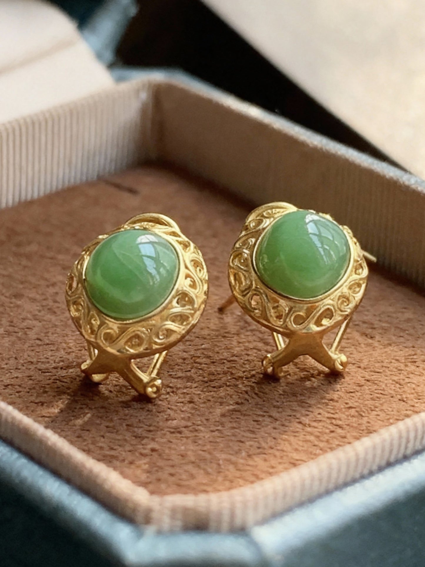 Nephrite jade earrings with traditional green stone