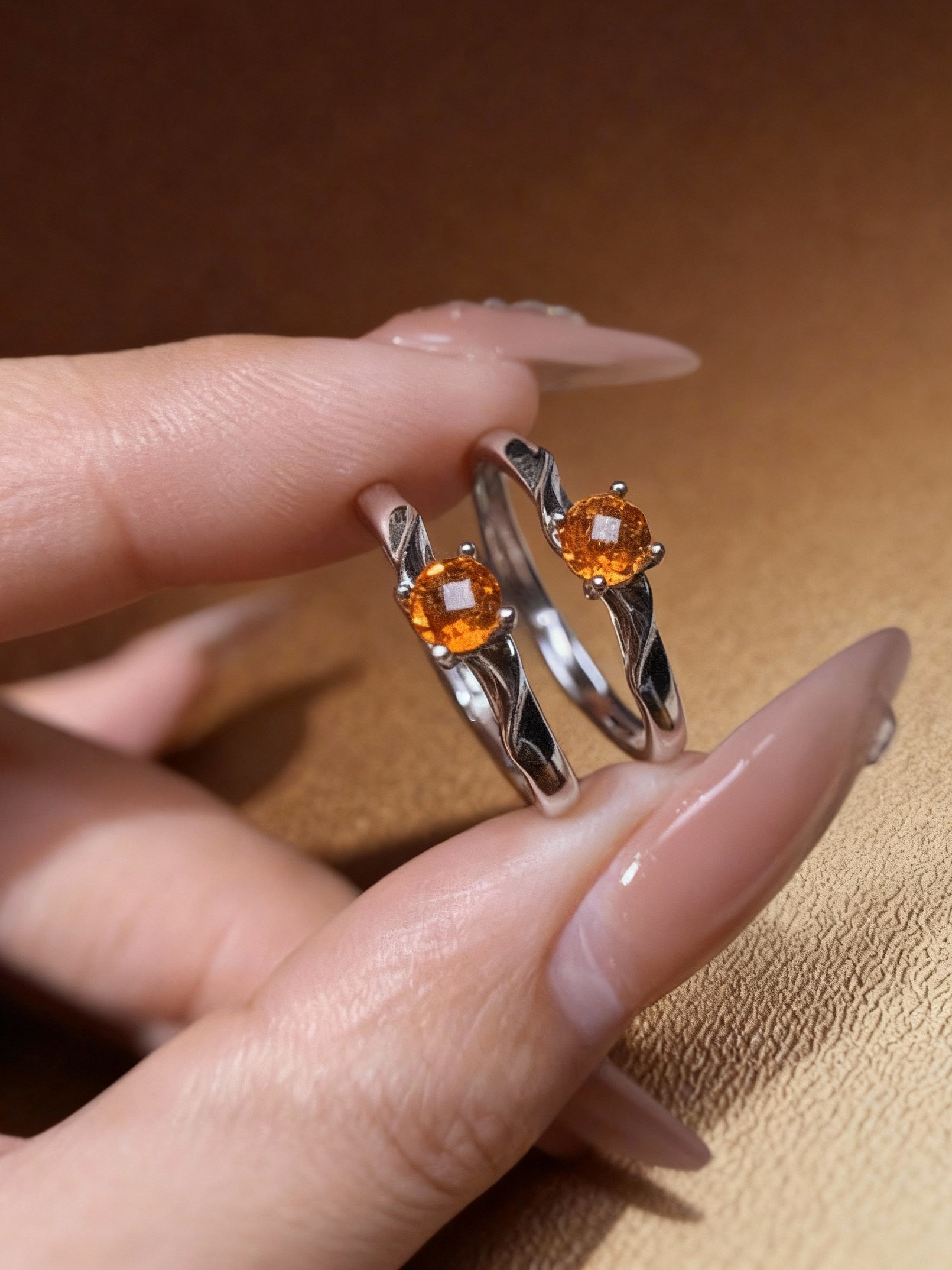 Golden citrine gemstone ring with artistic wave pattern