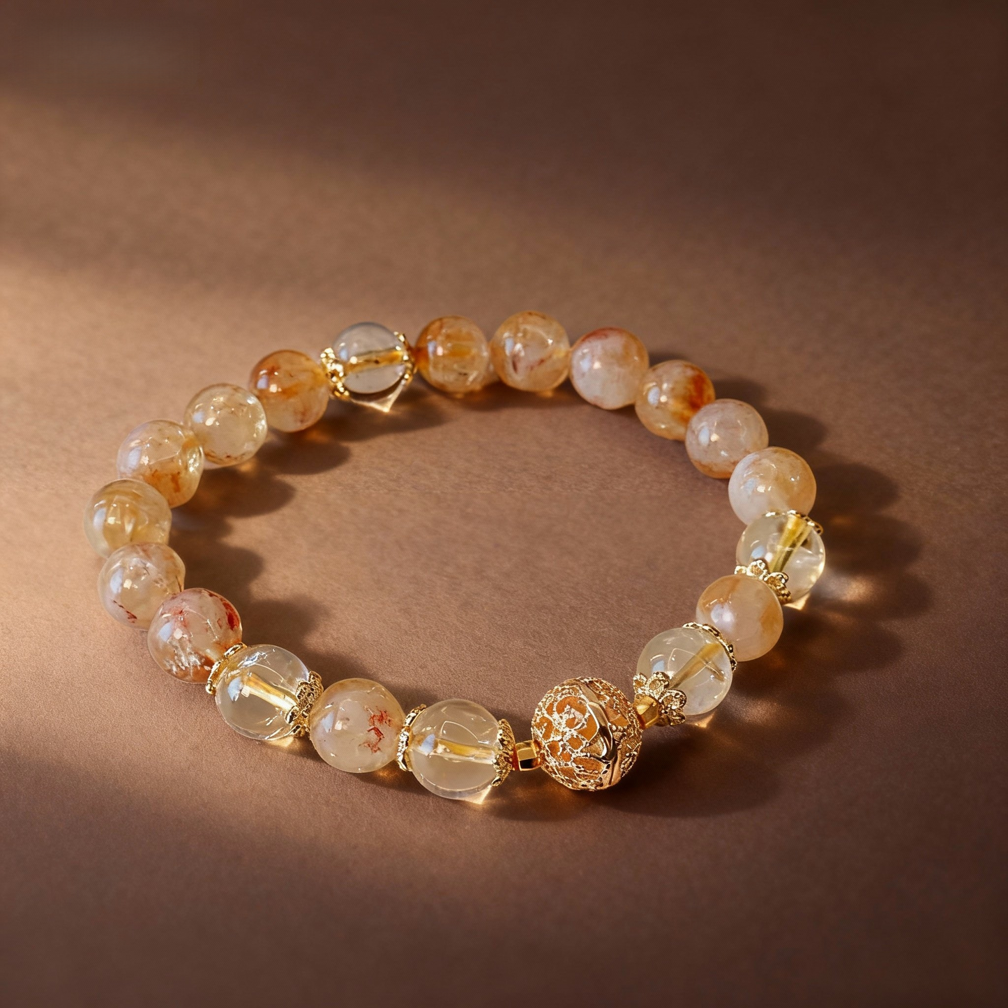 Natural golden rutilated quartz bracelet with metal ball bead