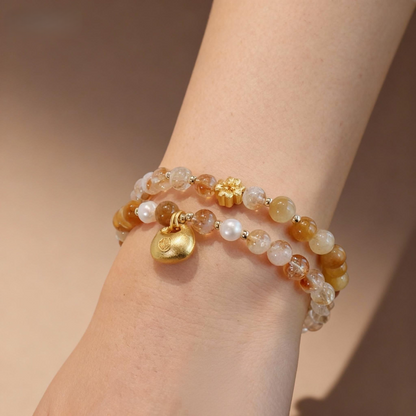 Natural rutilated quartz double-strand bracelet with lock charm