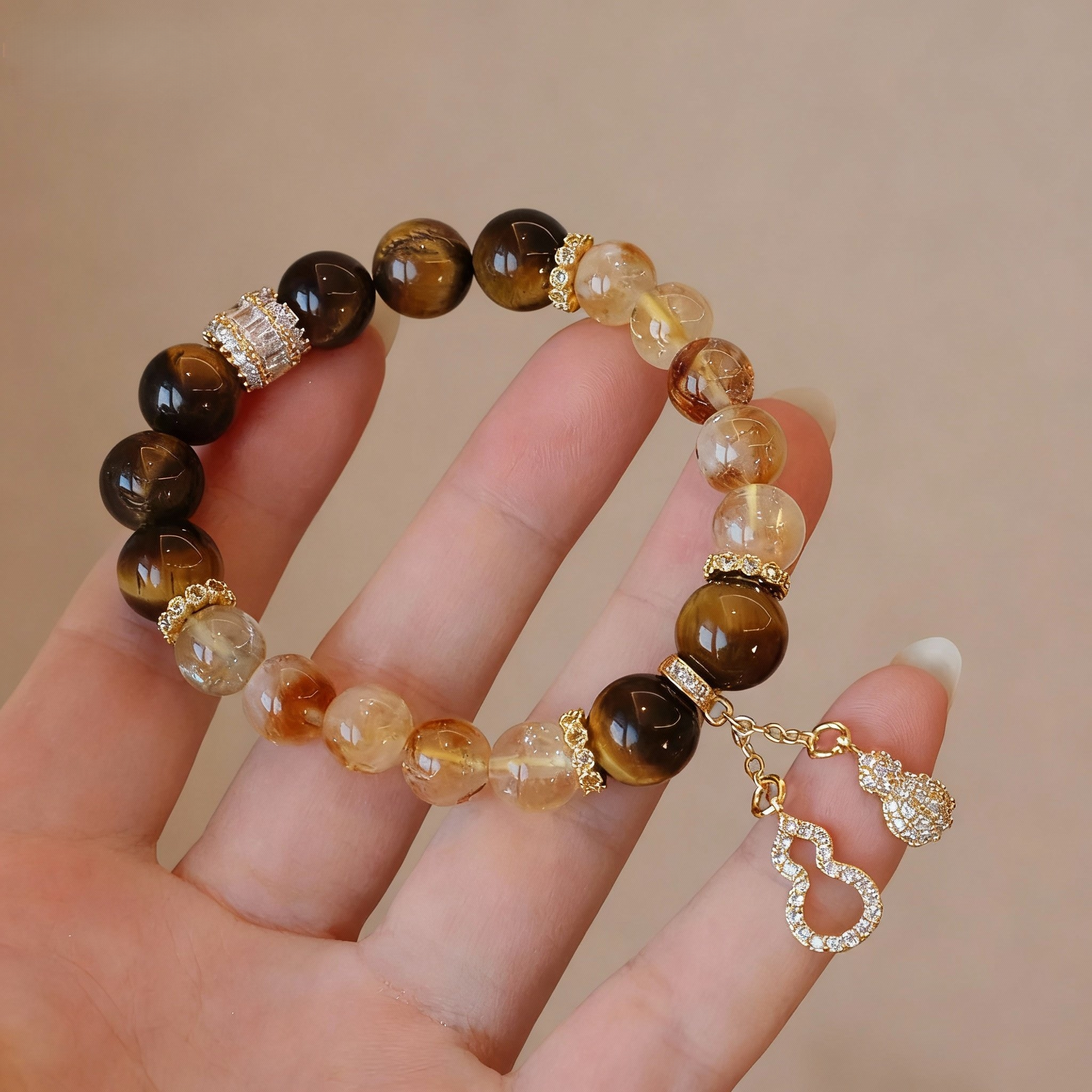 Natural rutilated citrine bracelet with tiger eye and gourd charm
