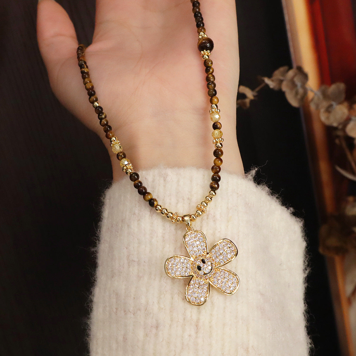 Tiger eye and zircon flower sweater chain showing bead arrangement