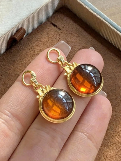 Blood amber pendant necklace with warm reddish-brown tones