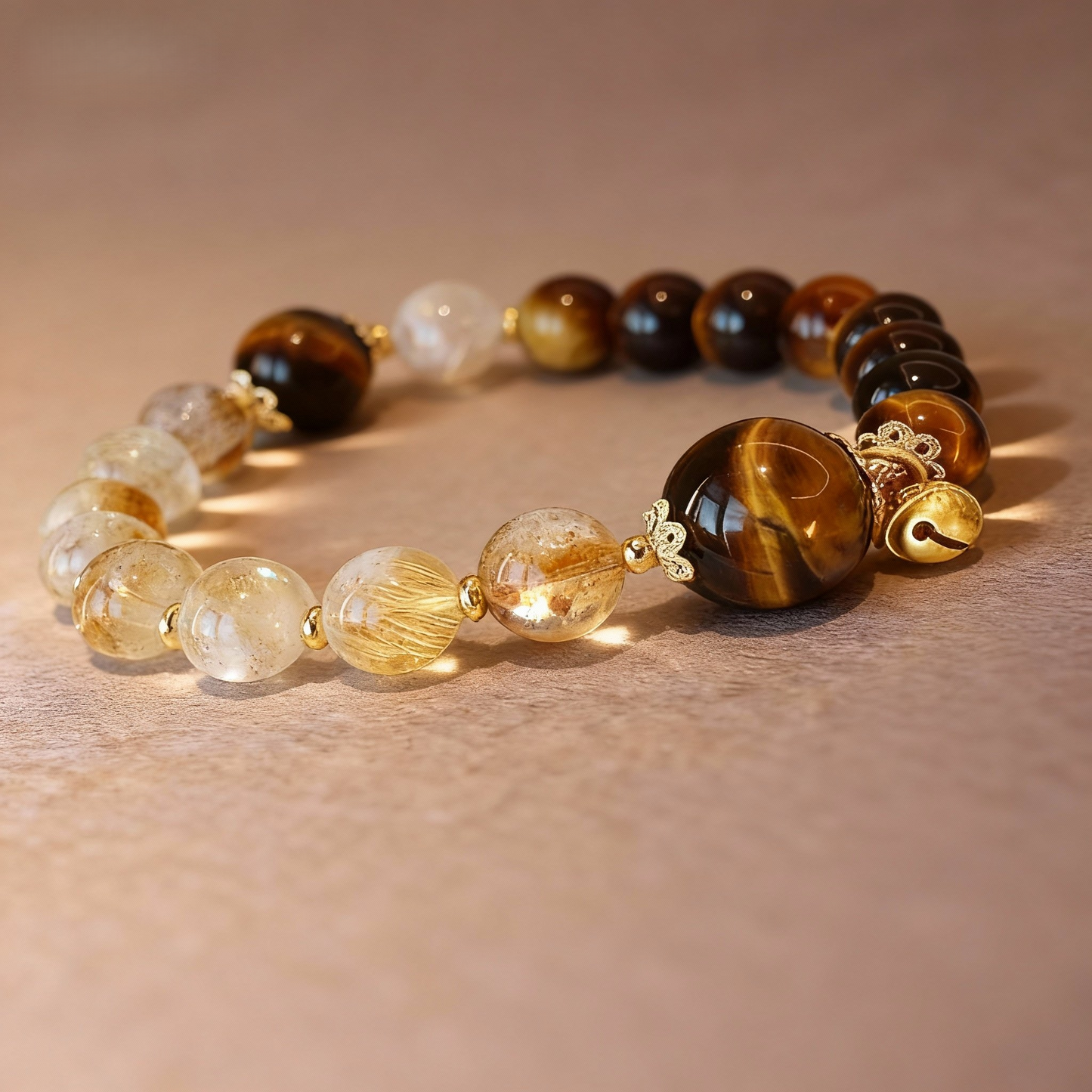 Detail of golden citrine and tiger eye bracelet with crystal gourd