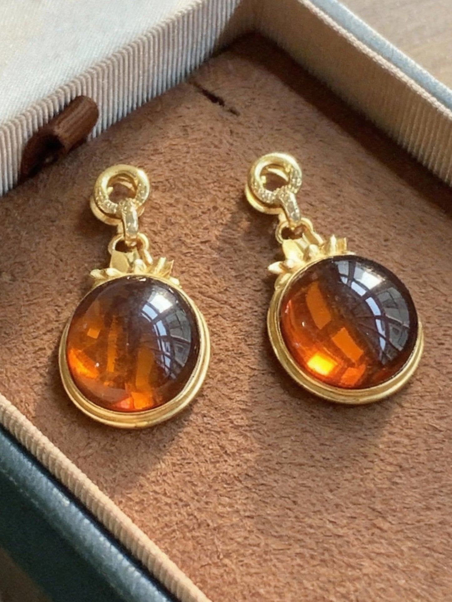 Natural blood amber pendant showing deep color and clarity