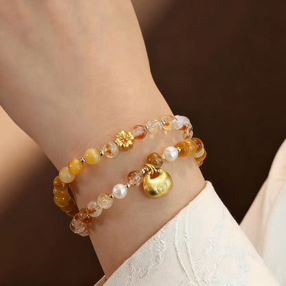 Golden rutilated quartz bracelet showing double-strand design