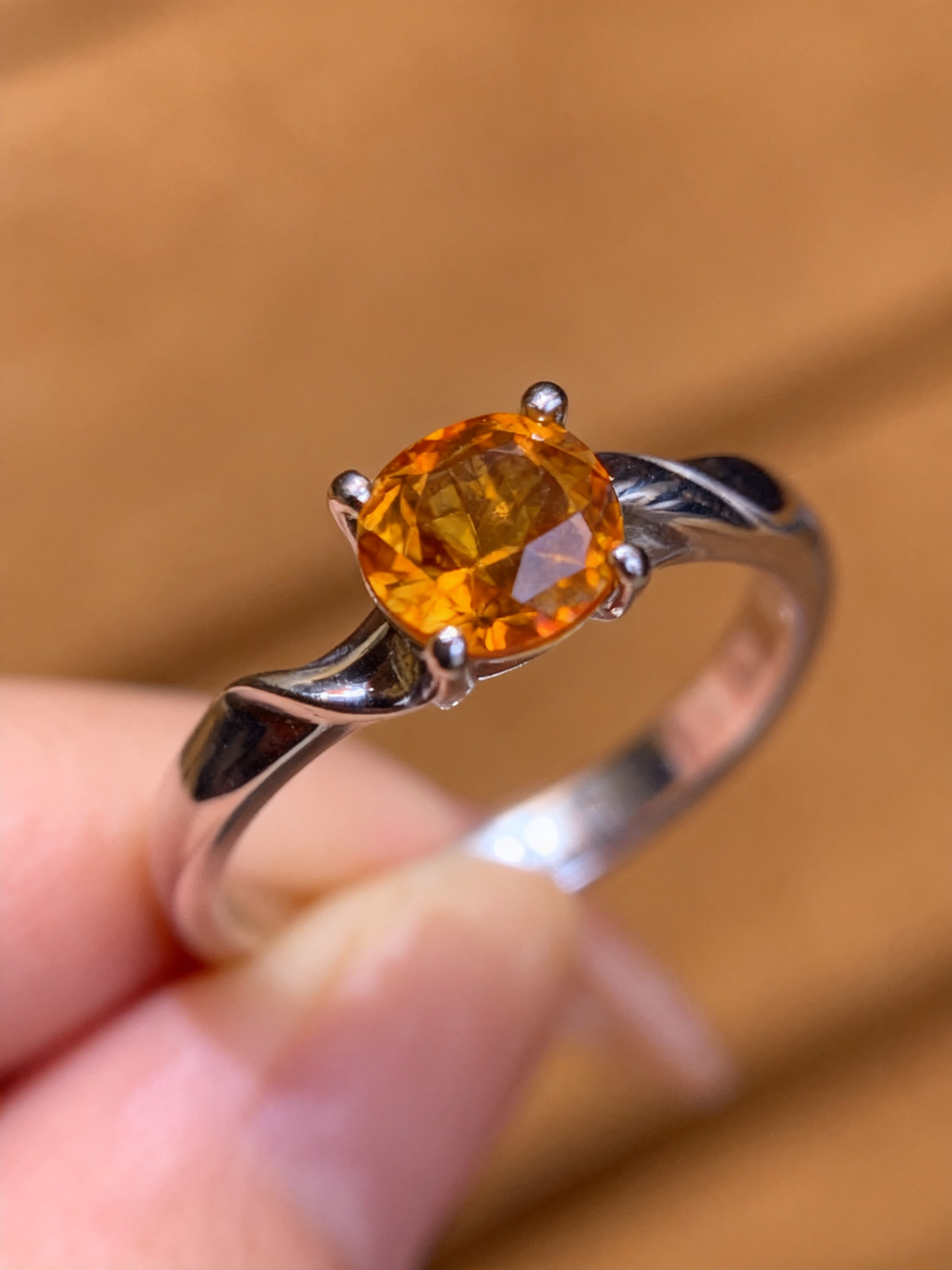 Natural citrine ring showing wave design and golden color